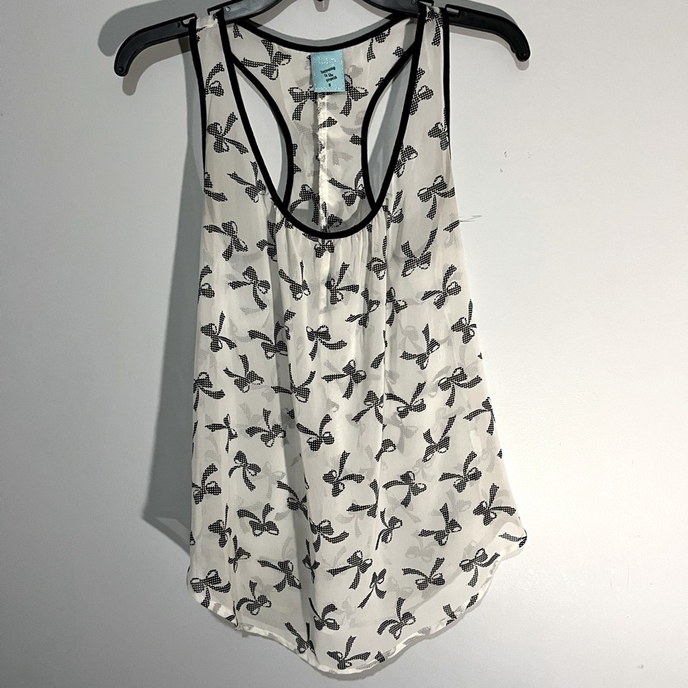 Racerback sheer tank with bow print. I like the ruffles on the back. Fits XS/S